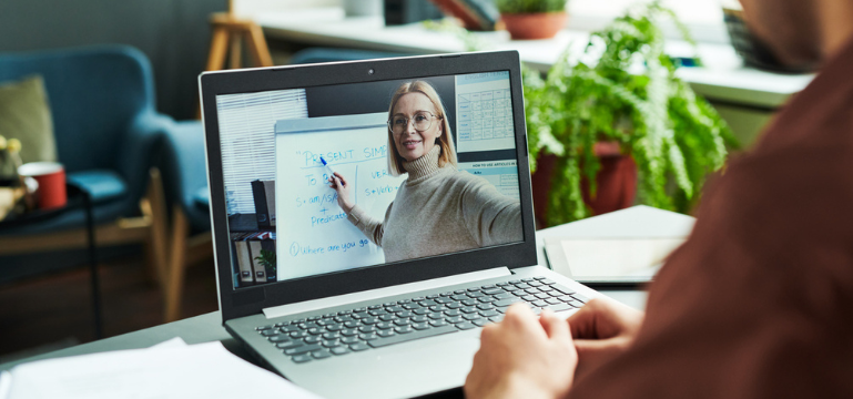 Student attending an online Microsoft Teams meeting with a lecturer presenting.