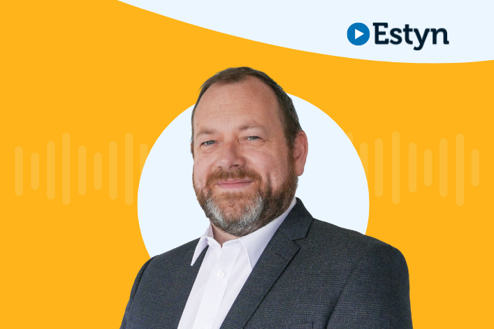 A portrait of a professional individual with the Estyn logo on the upper right, set against a dual-tone background of yellow and white.