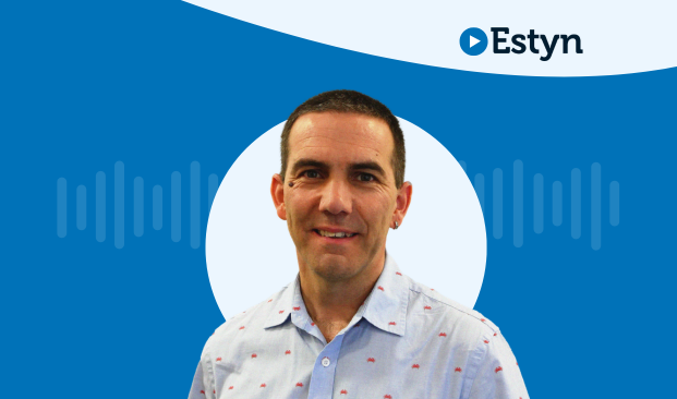 A studio-style portrait of a person set against a blue graphic background featuring a white circular shape and subtle waveform design. The Estyn logo appears in the top right corner.