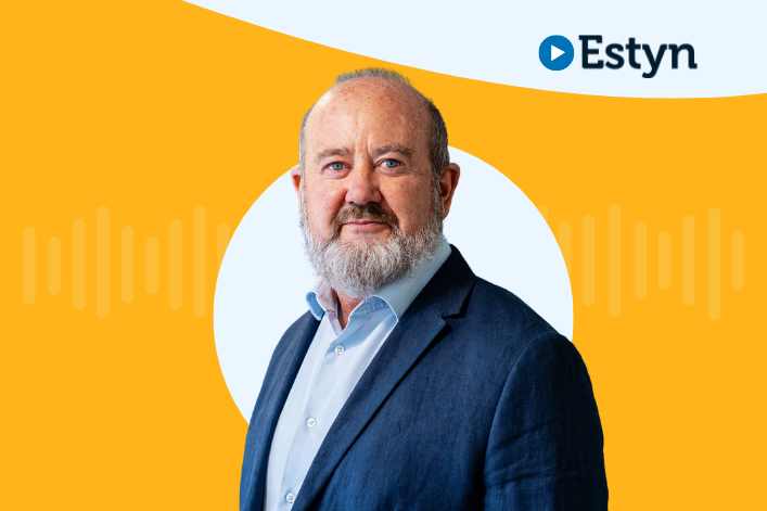 Estyn logo on blue background