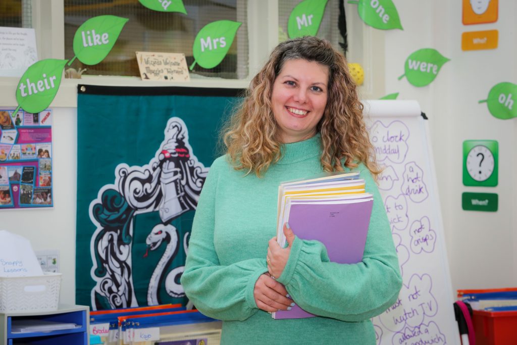 Teacher holding books