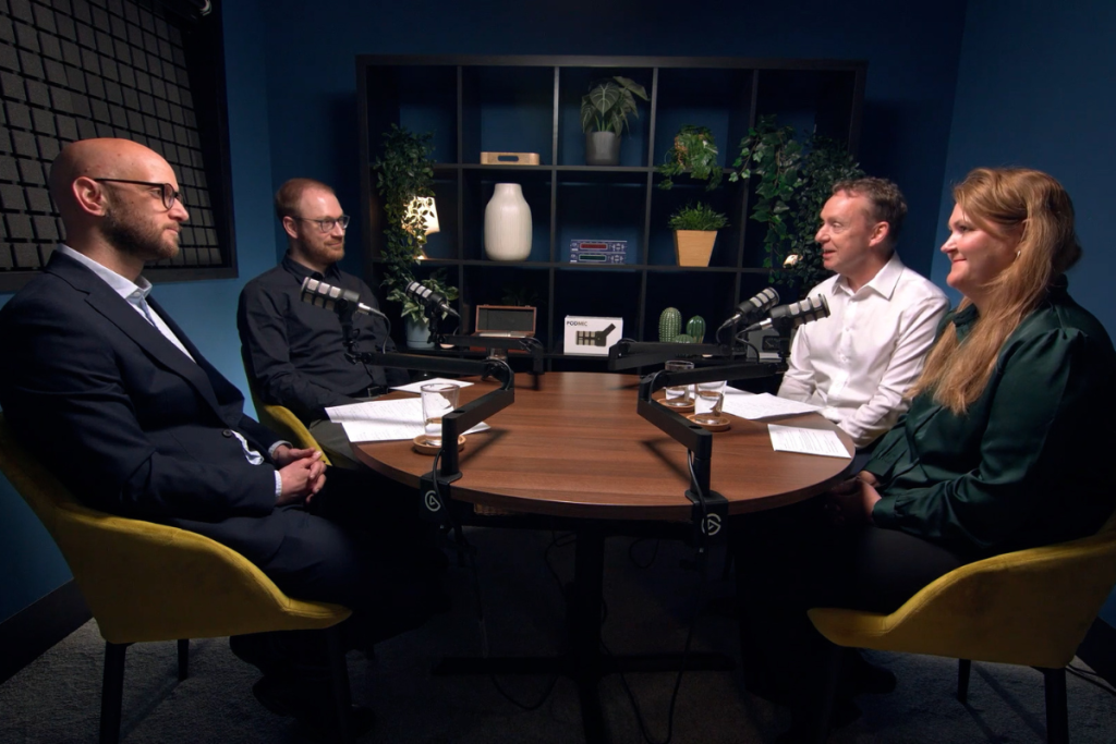 4 people in a podcast studio